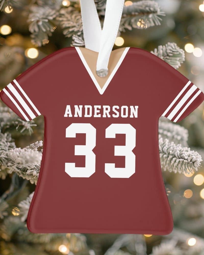 A maroon football jersey ornament with the name Anderson and number 33.