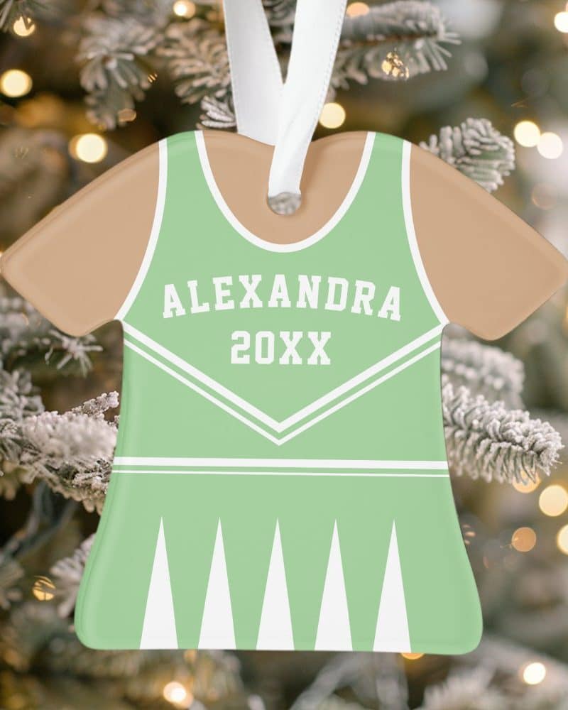 Personalized light green cheerleader uniform-shaped Christmas ornament with the name Alexandra and year 20XX.