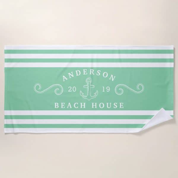 Mint Green And White Striped Beach Towel With The Anderson Beach House Logo, Featuring An Anchor And The Numbers 20 And 19.