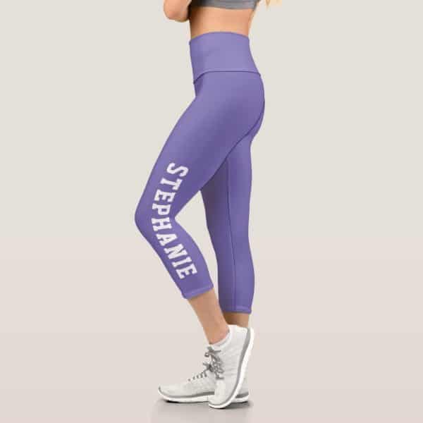 Purple Capri Leggings With The Name Stephanie Printed Vertically On The Side.