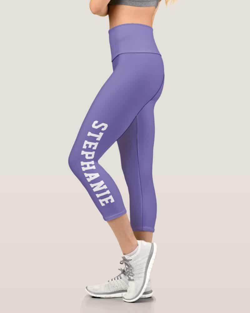 Purple capri leggings with the name Stephanie printed vertically on the side.