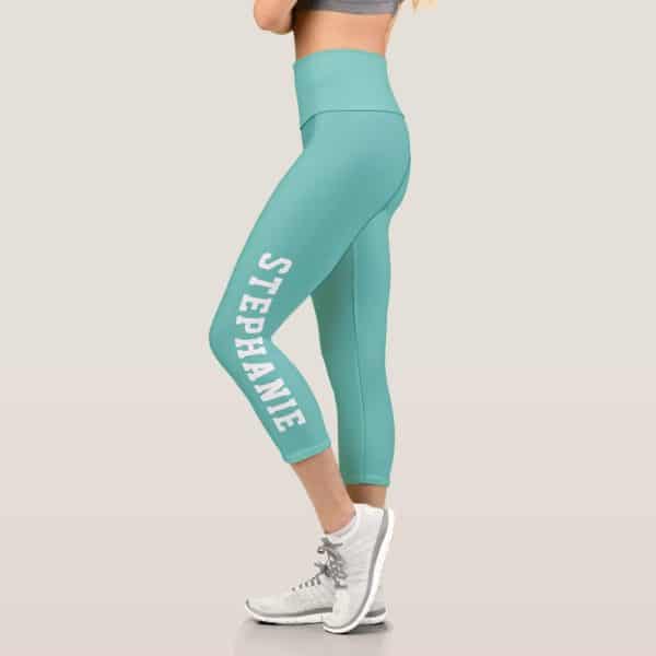 Teal Capri Leggings With The Name Stephanie Printed Vertically On The Side.