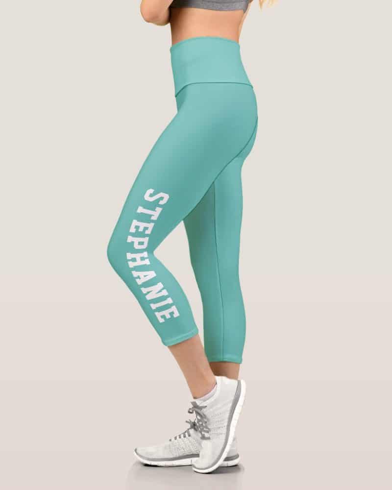 Teal capri leggings with the name Stephanie printed vertically on the side.