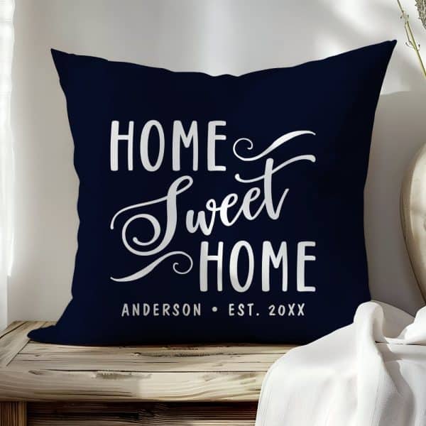 Navy Blue Throw Pillow With The Text Home Sweet Home In A Stylized White Script Font. A Name And Year Are Also Printed At The Bottom.