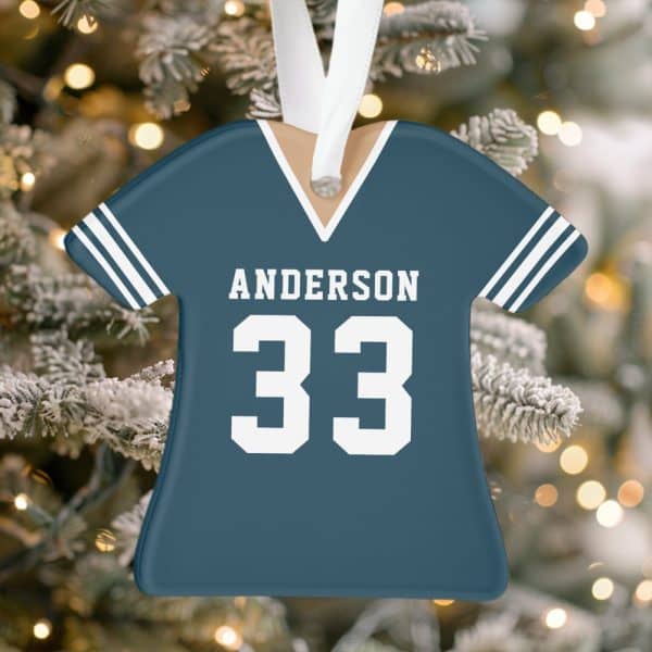 A Teal Blue Jersey-Shaped Christmas Ornament With The Name Anderson And Number 33.