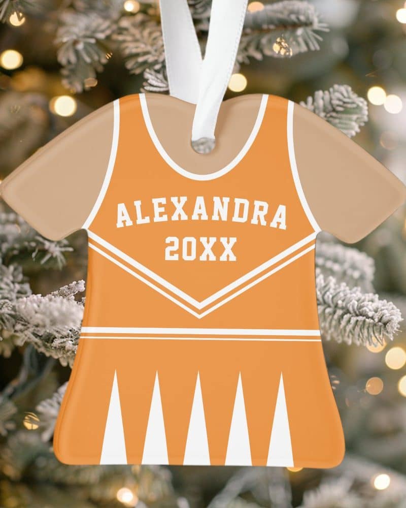 Orange and beige personalized cheerleader uniform shaped Christmas ornament.