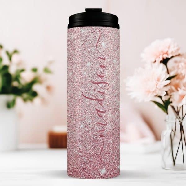 Pink Glitter Travel Tumbler With The Name Madison In A Cursive Script.