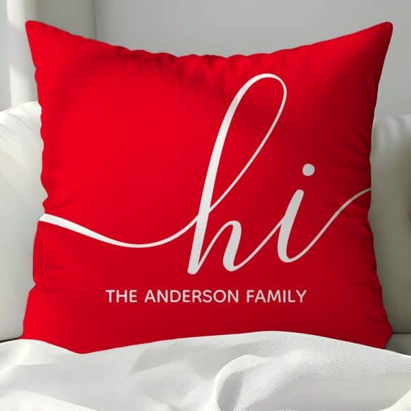 Red Pillow With White Cursive &Quot;Hi&Quot; And &Quot;The Anderson Family&Quot; Below.