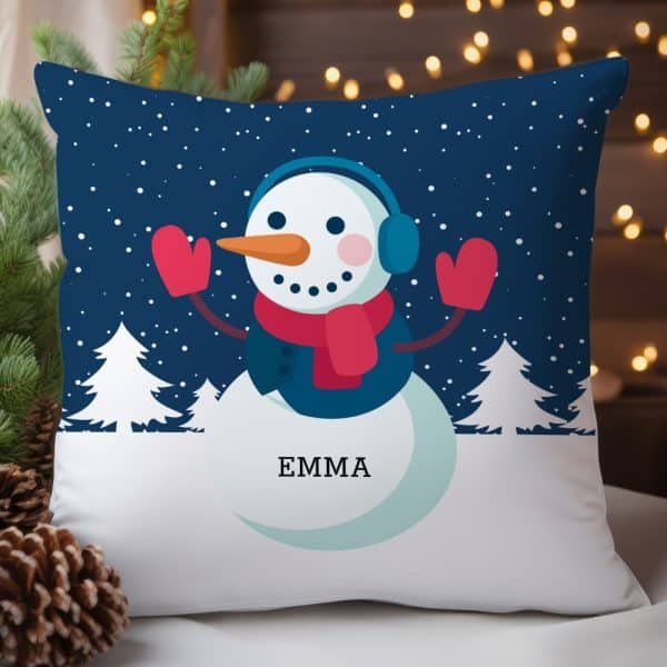 A Throw Pillow Featuring A Smiling Snowman Wearing Earmuffs And Mittens. The Name Emma Is Printed Below The Snowman.