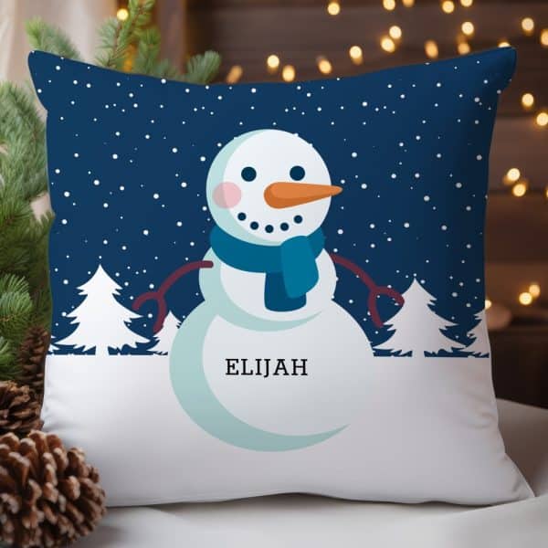A Throw Pillow Featuring A Cartoon Snowman With The Name Elijah.