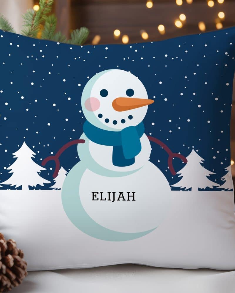 A throw pillow featuring a cartoon snowman with the name Elijah.