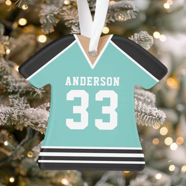A Teal And Black Personalized Jersey-Shaped Christmas Ornament With The Name Anderson And Number 33.