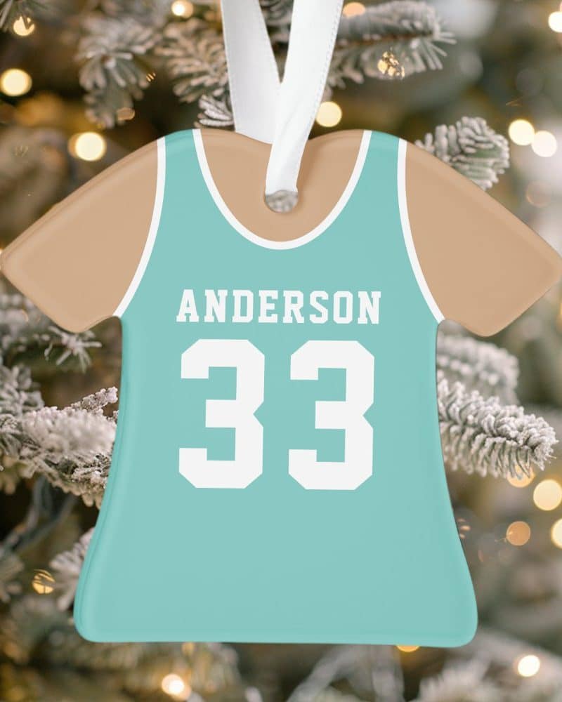 Teal and tan jersey-shaped Christmas ornament with the name Anderson and number 33.