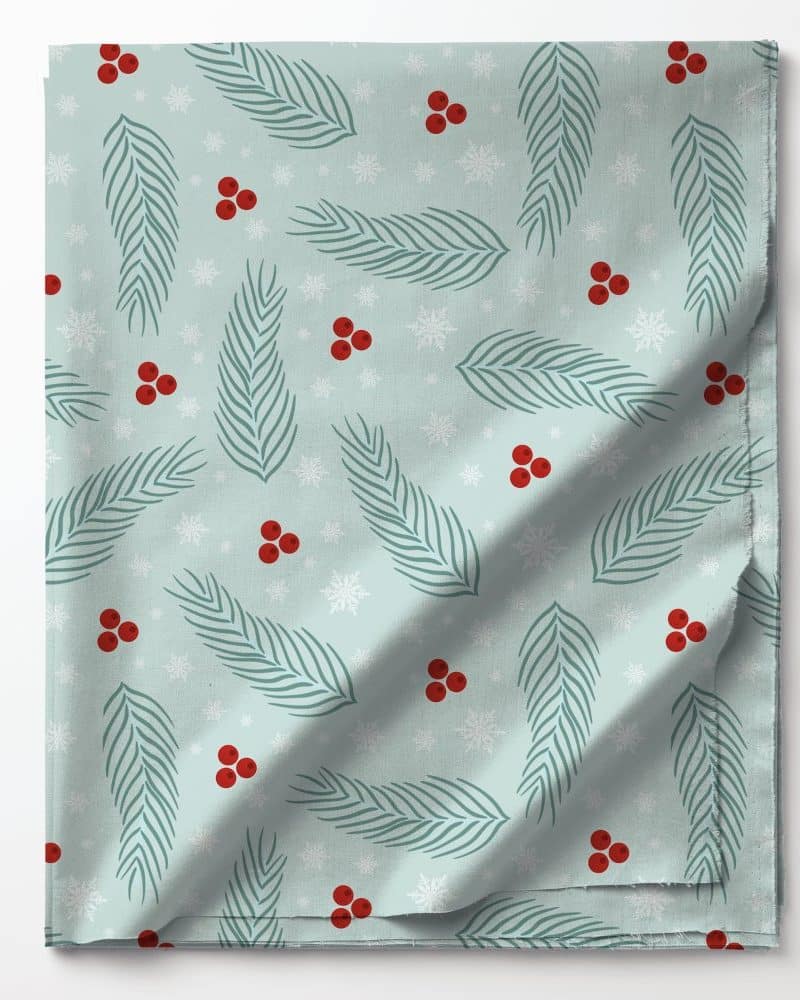 Light blue fabric with a repeating pattern of teal pine branches, red berries, and white snowflakes.