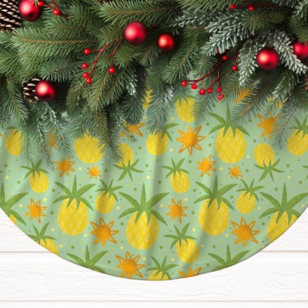 A Christmas Tree Skirt With A Light Green Background And A Repeating Pattern Of Yellow Pineapples And Orange Suns.