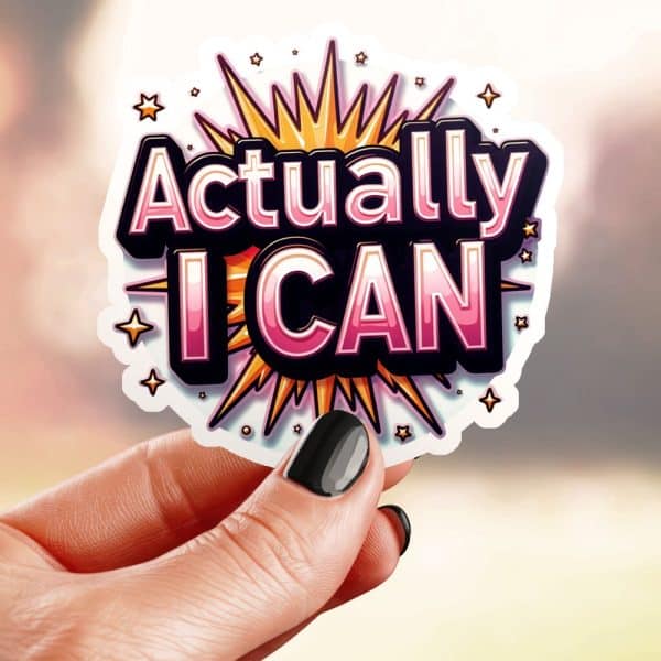 Hand Holding A Sticker That Says Actually I Can In Stylized Lettering With A Starburst Design.