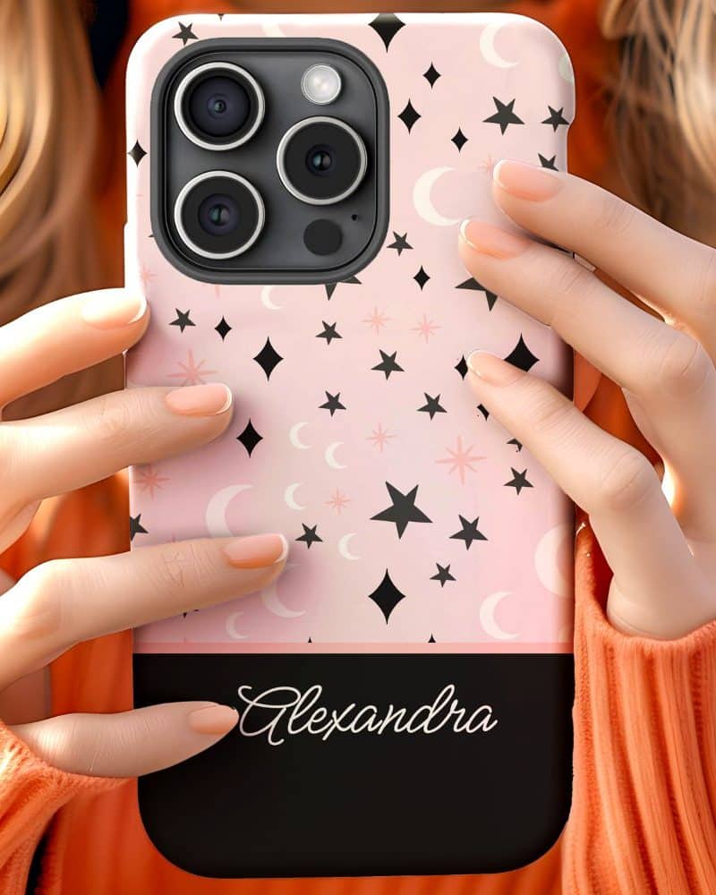 Pink phone case with black stars and moons, personalized with the name Alexandra.