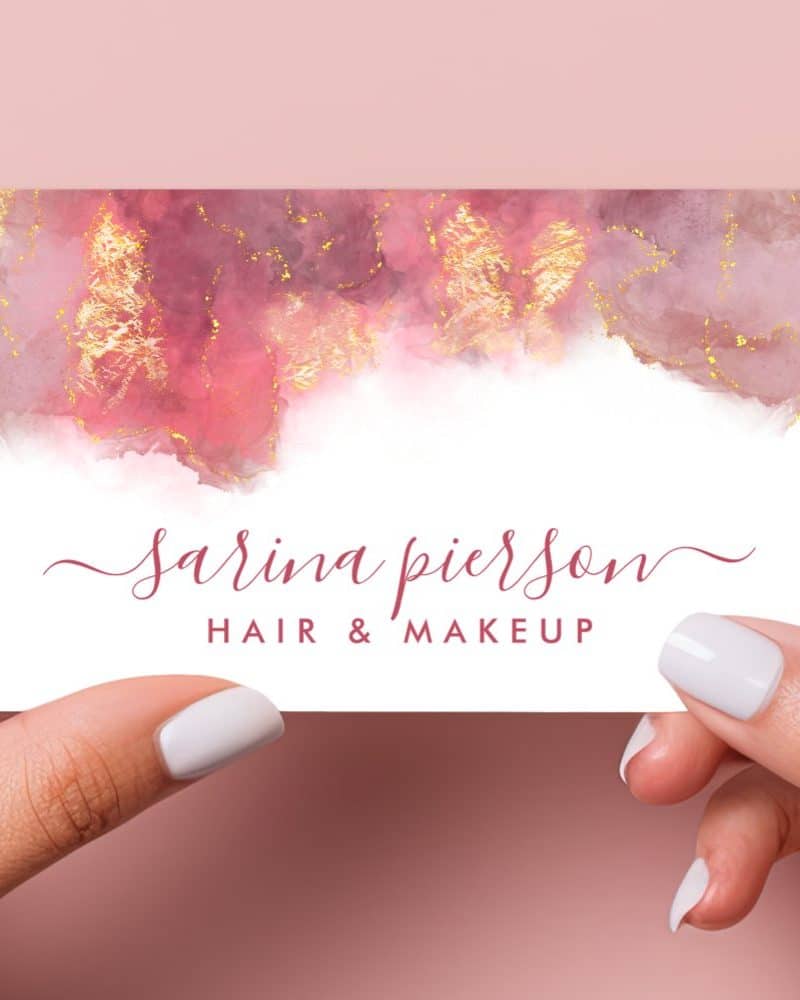 A pink and gold business card for Sarina Pierson, hair and makeup artist.