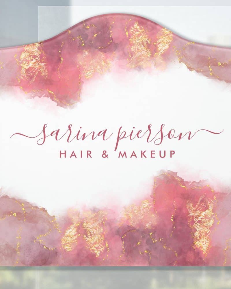 Arched pink and gold business sign for Sarina Pierson Hair & Makeup.