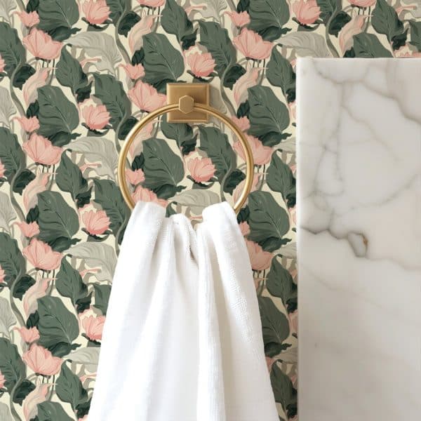 White Towel Hanging On A Gold Ring Against A Floral Wallpaper.
