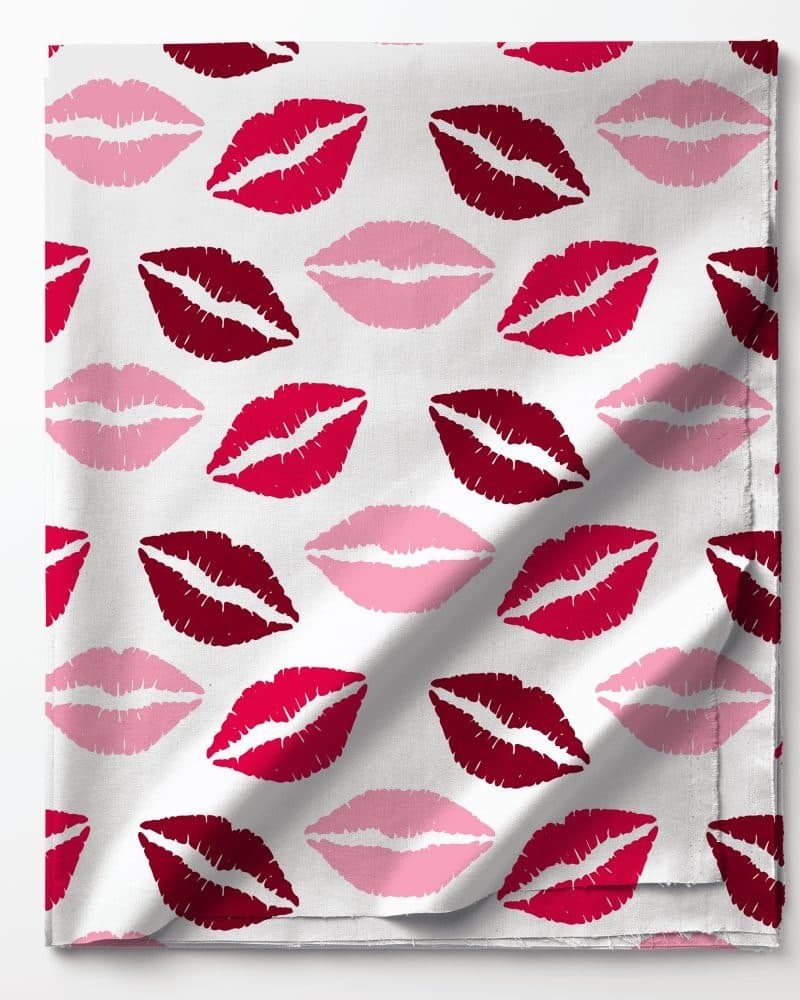 Fabric with a repeating pattern of red and pink lips.