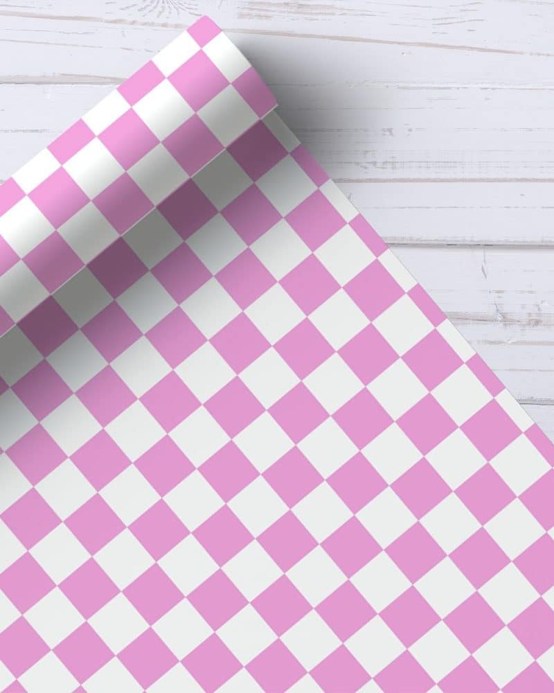 Pink and white checkered wrapping paper roll.