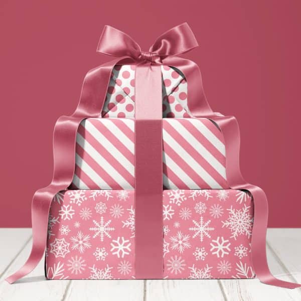 Stack Of Three Pink Gift Boxes With A Large Pink Ribbon.