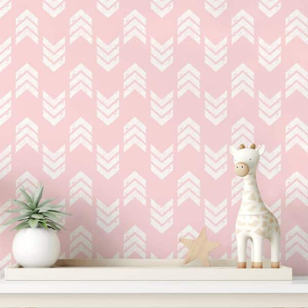 Pink Wall With A White Chevron Pattern, Featuring A Small Giraffe Toy And A Succulent Plant On A Shelf.