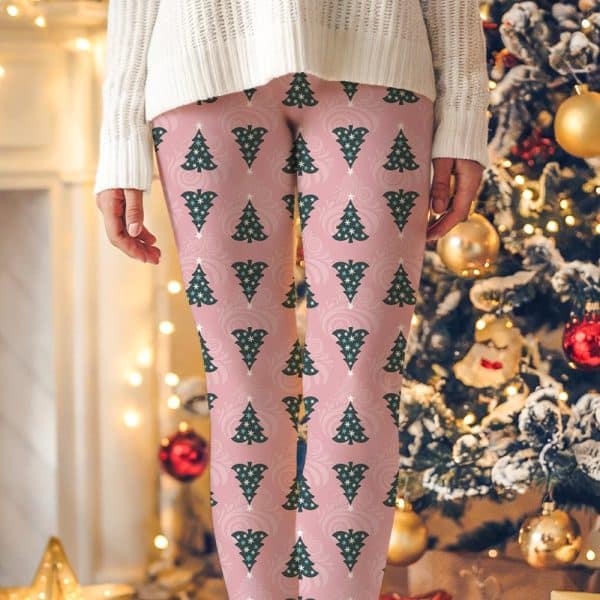 Pink Leggings With A Repeating Pattern Of Dark Green Christmas Trees.