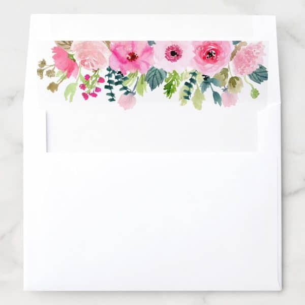 White Envelope With A Pink And Green Watercolor Floral Border At The Top.