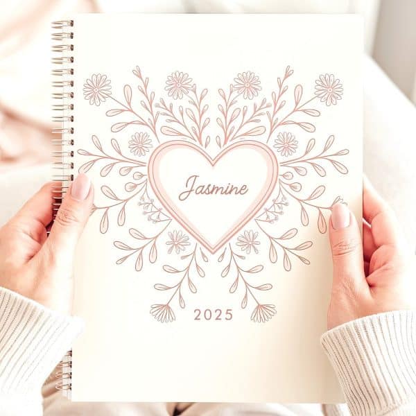 Hands Holding A 2025 Planner Featuring A Floral Heart Design And The Name Jasmine.