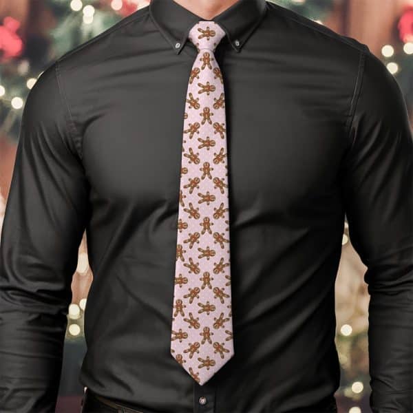 Man Wearing A Pink Tie Featuring A Repeating Pattern Of Gingerbread Men.