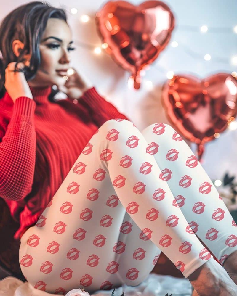 Woman wearing off-white leggings with a pink lip print.