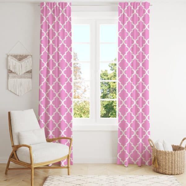 Pink Curtains With A Quatrefoil Pattern Hang In Front Of A Window.