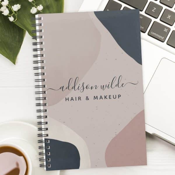 Spiral-Bound Notebook With An Abstract Design In Muted Pink, Beige, And Blue Featuring The Name Addison Wilde Hair &Amp; Makeup.