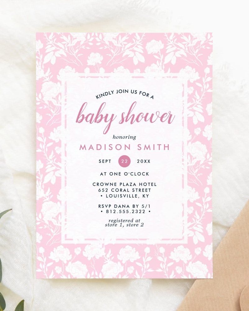 Pink baby shower invitation with white floral pattern; Madison Smith is the honoree.