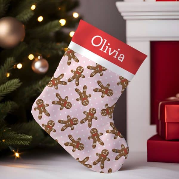 Pink Christmas Stocking With Gingerbread Men Pattern And Olivia'S Name.