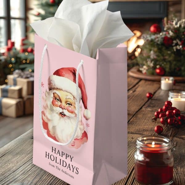 Pink Gift Bag With A Vintage Santa Claus Illustration And Happy Holidays Text.