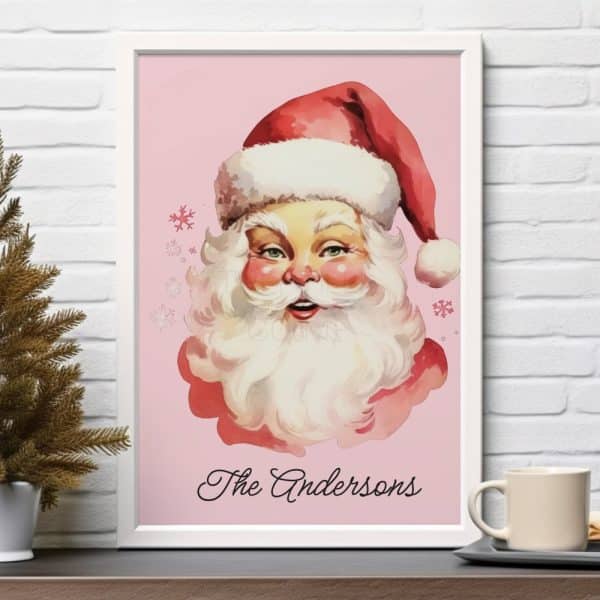 Framed Illustration Of Santa Claus'S Face On A Pink Background With The Name Andersons Below.