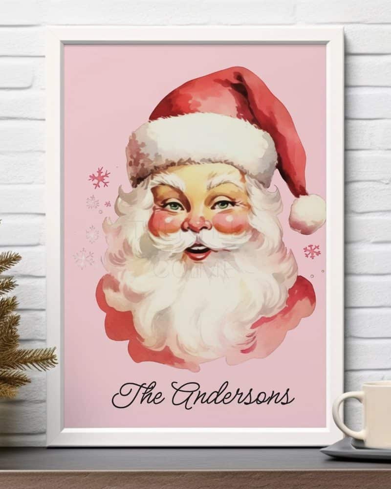 Framed illustration of Santa Claus's face on a pink background with the name Andersons below.