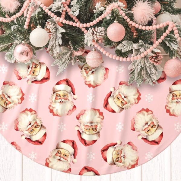 Pink Christmas Tree Skirt With A Repeating Pattern Of Santa Claus Faces.