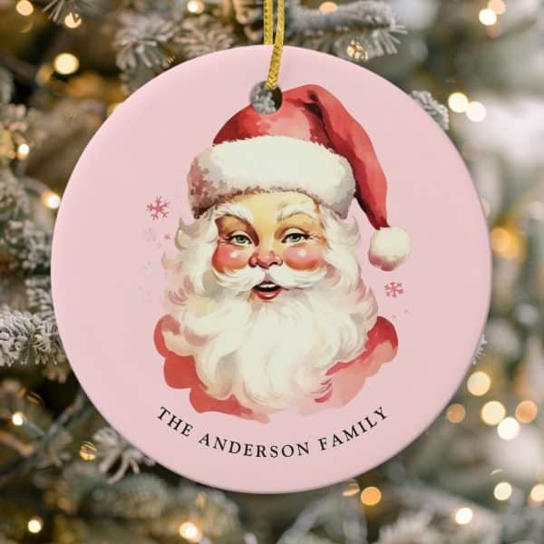 Pink Round Christmas Ornament Featuring A Vintage Illustration Of Santa Claus'S Face, With The Text The Anderson Family Below.