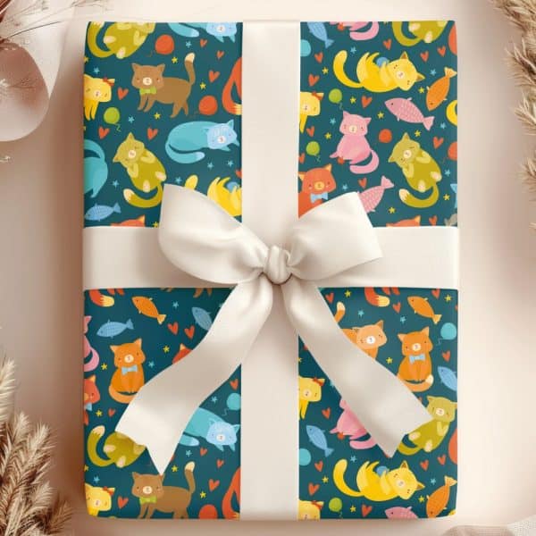 Gift Wrapped In Teal Paper Featuring A Repeating Pattern Of Colorful Cartoon Cats And Fish, Tied With A White Ribbon.