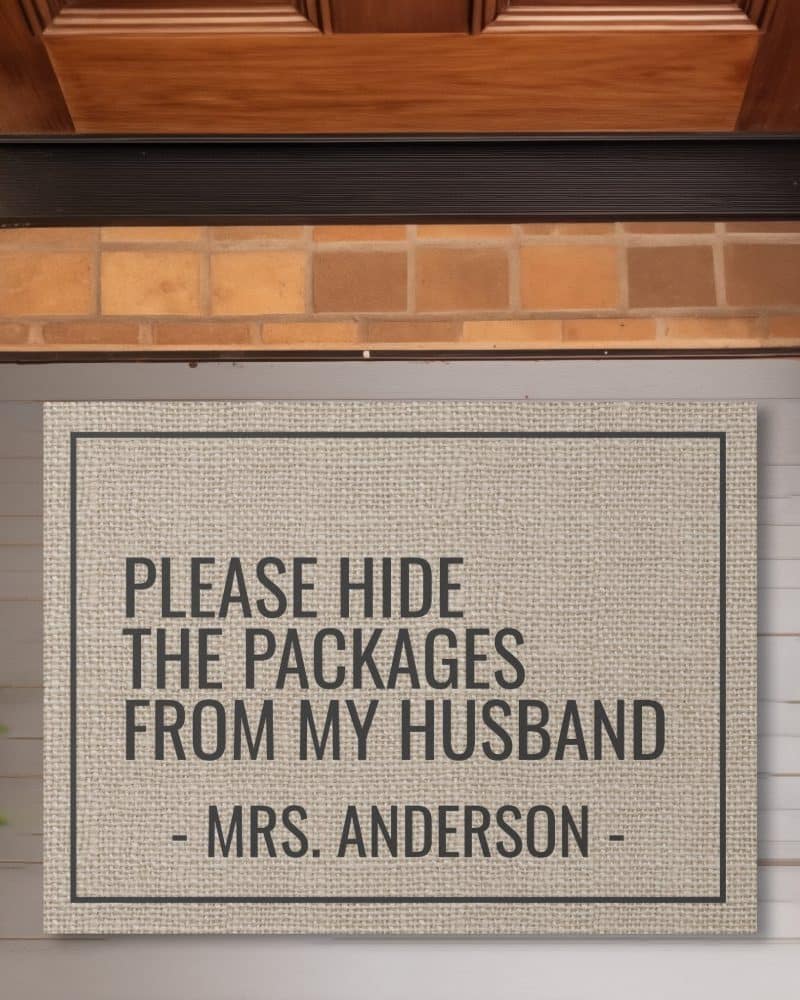 Beige doormat with the text Please Hide the Packages from My Husband Mrs. Anderson.