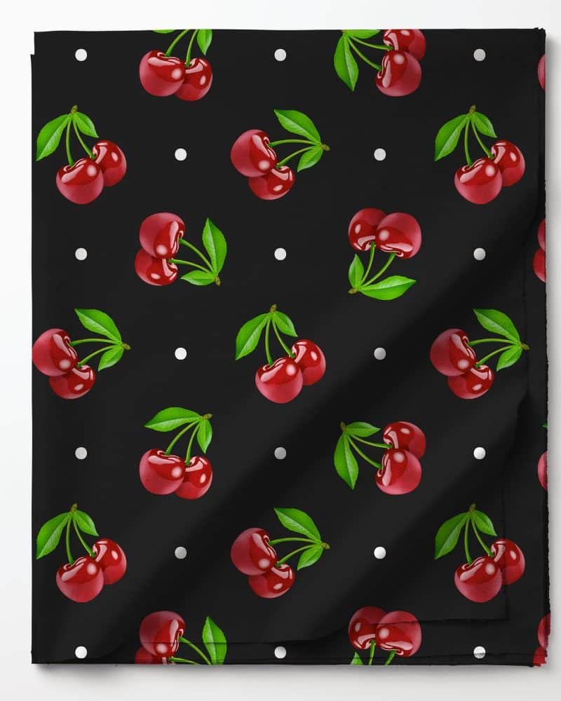 Black fabric with a repeating pattern of red cherries and white dots.