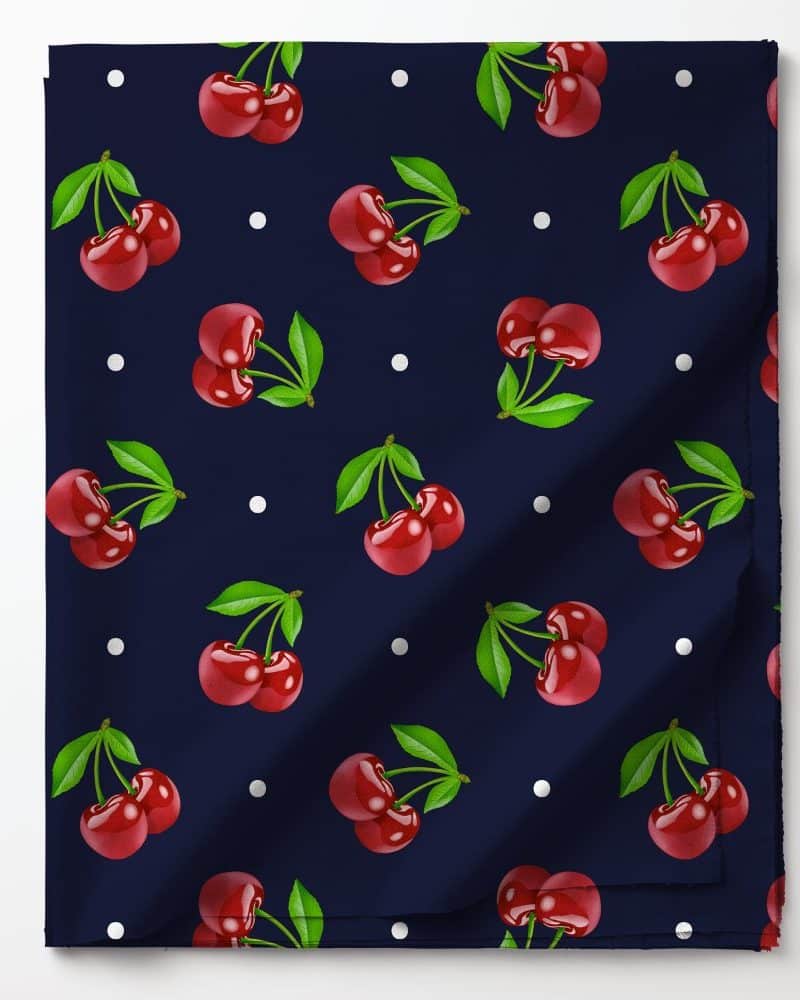 Dark blue fabric with a repeating pattern of red cherries and white dots.