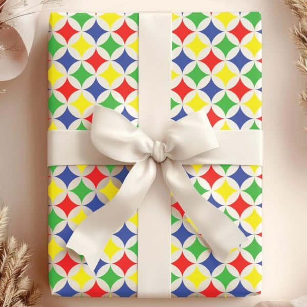 Gift Box With Colorful Geometric Pattern And White Ribbon.