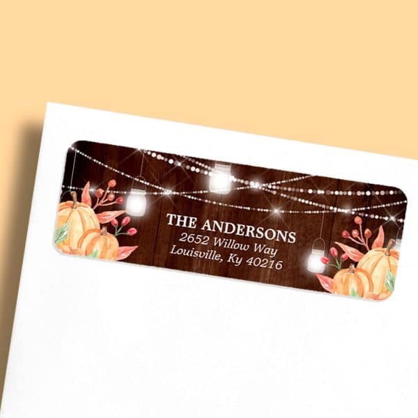 Return Address Label With Autumn Theme; Pumpkins, Lights, And The Andersons Family Name And Address.
