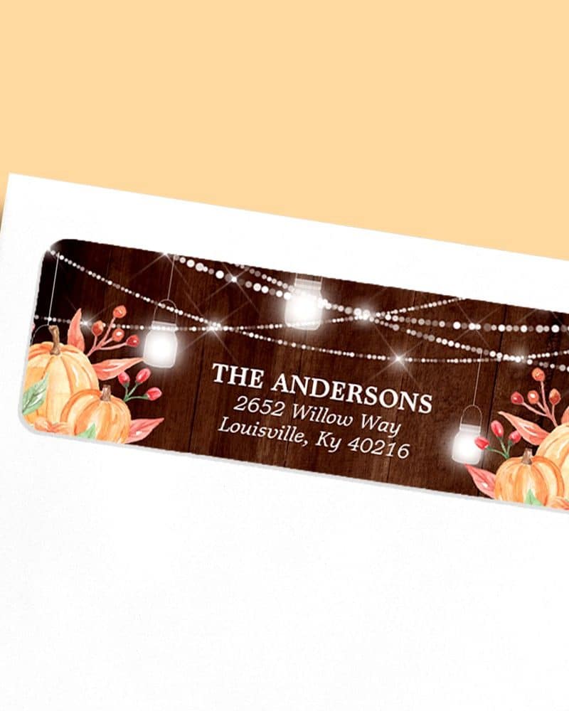 Return address label with autumn theme; pumpkins, lights, and the Andersons family name and address.