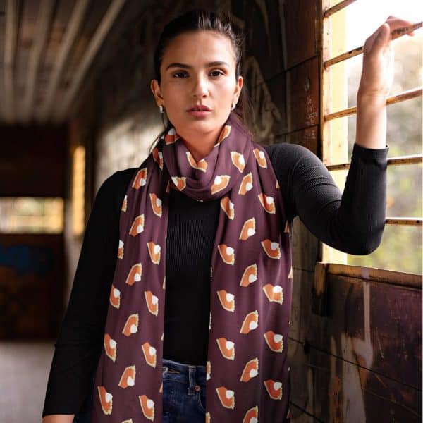 Woman Wearing A Maroon Scarf Printed With Pumpkin Pie Slices.